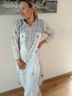 Hand embroidered cotton tunic White Bohemian Tunic With Chikankari Embroidery, Bohemian Cotton Tunic With Floral Embroidery, White Cotton Tunic With Floral Embroidery, Summer White Kaftan With Resham Embroidery, White Summer Kaftan With Resham Embroidery, White Kaftan With Resham Embroidery For Summer, White Resham Embroidery Kaftan For Summer, White Resham Embroidered Kaftan For Summer, Bohemian Embroidered Cotton Tunic