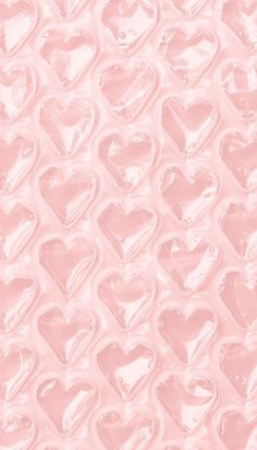 a pink background with many hearts on it