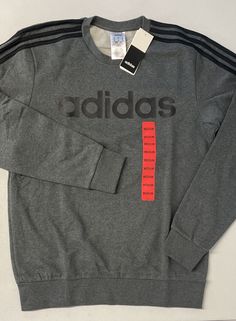 Adidas Essentials Men's 3 Stripe Fleece Sweatshirt  Size: Medium Color: Dark Grey / Black Stripes Neckline: Crewneck Condition is NEW WITH TAGS.  Free shipping. Stripe Sweatshirt, Adidas Pullover, Striped Sweatshirts, Mens Essentials, Pullover Men, Grey Sweatshirt, Adidas Men, Black Stripes, Dark Grey