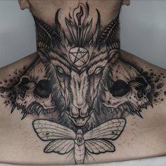 a man with tattoos on his neck and chest is wearing an animal head tattoo design