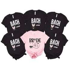 the bride crew shirts in black and pink are shown with their names on them, including one