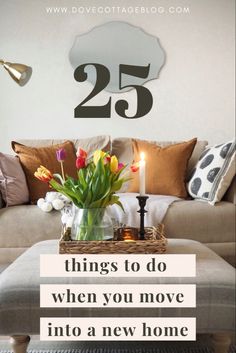 a living room filled with furniture and flowers on top of a coffee table next to a couch