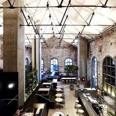 the interior of a restaurant with exposed brick walls