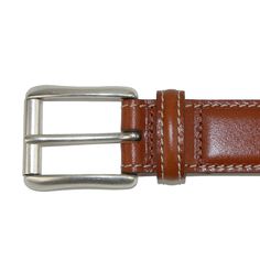 Italian vegetable dyed smooth calfskin features a natural vegetable dyed leather lining for a full genuine leather belt. The solid brass buckle has a silver tone and features a roller. Expertly stitched with contrast thread, this item is made by hand in America. Made of Italian Vegetable Dyed Calfskin Brown Bridle Leather Belt With Removable Buckle, Classic Bridle Leather Belt With Removable Buckle, Classic Brown Rectangular Belt Buckles, Classic Brown Bridle Leather Belt, Classic Business Belt In Bridle Leather, Classic Bridle Leather Business Belt, Classic Bridle Leather Belt For Business, Classic Leather Belt Buckles With Removable Belt, Classic Bridle Leather Belt And Suspenders