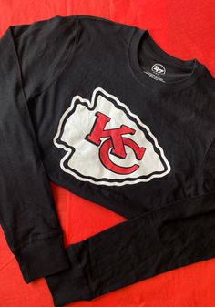 47 Kansas City Chiefs Black Imprint Long Sleeve T Shirt - 48001461 Kansas City Chiefs Sweater, Kansas City Chiefs Cricut Shirt, Chiefs Super Bowl Shirts, Fall Fan Apparel T-shirt With Logo Print, Game Day Graphic Tee With Long Sleeves, Collegiate Long Sleeve T-shirt With Graphic Print, Collegiate Long Sleeve Graphic Print T-shirt, Long Sleeve Graphic Print T-shirt For Sports Fans, Graphic Print Crew Neck Top For Fans