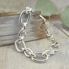 It's just my style! Our Linked-Up Bracelet comes to you in handcrafted sterling silver. The rich silver links vary in size and width with smooth oval-shaped shine. The bracelet measures approximately 1-inch at the widest and 3/8-inches at the narrowest. Available in two sizes: Standard measures 8-inchesLarge measures 9-inches (for a small additional fee) Note: Due to the chunky links, the 8-inch fits standard wrist size and the 9-inch fits large size wrist. If you love heavy silver chunky pieces Sterling Silver Bracelets With Chunky Chain In Oval Link, Modern Sterling Silver Chunky Chain Bracelet, Sterling Silver Oval Link Bracelet With Polished Finish, Modern Sterling Silver Bracelet With Rolo Chain, Modern Sterling Silver Bracelet With Oval Link, Everyday Sterling Silver Bracelet With Chunky Chain, Modern Oval Sterling Silver Bracelet, Silver Oval Link Chunky Chain Bracelet, Silver Bracelets With Chunky Oval Link Chain