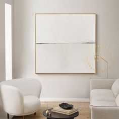 a living room with two white chairs and a coffee table in front of a painting on the wall