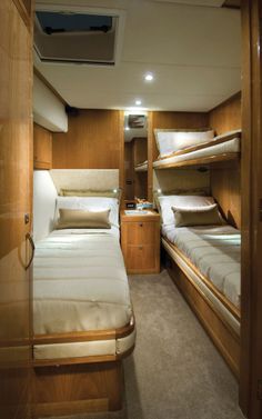 the inside of a boat with bunk beds and other items in it's cabin