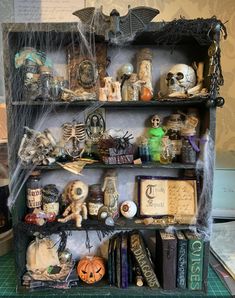 a shelf filled with lots of halloween decorations