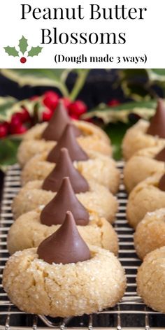 some cookies with chocolate frosting and christmas trees on top are sitting on a cooling rack