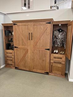 an open closet with wooden doors and drawers