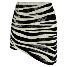 SAINT LAURENT mini skirt comes in a black & white zebra print acetate / viscose featuring an asymmetrical hem and a hidden zip up closure. Made in Italy. Excellent Pre-Owned Condition. Marked: F 38 Measurements: Waist: 26 inches Hip: 17 inches Length: 15.5 inches Reference: 118106 Category: Skirt More Details Brand: SAINT LAURENT Gender: Female Size: 2 Color: Black Color 2: Cream Fabric: Acetate / Viscose Material: Sequined Pattern: Zebra Style: Mini Age Group: Adult Paris Woman, White Zebra, Fashion Inspiration Design, Black Midi Skirt, Dress Suits, Asymmetrical Hem, Contemporary Fashion, Zebra Print, Black Cream