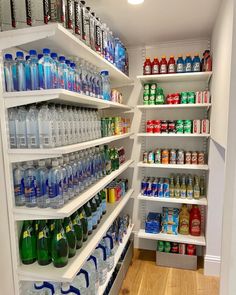 the shelves are filled with many different types of bottled water