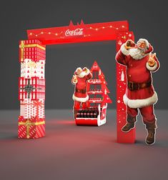 a coca - cola christmas display with santa claus