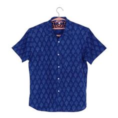 Against a body of solid indigo handsome stripes in snow white decorate this men's cotton shirt from India. Aftab designs and crafts this short-sleeve shirt which is decorated using the traditional block printing method where the designs are hand-carved into wood blocks that are used as stamps. Fitted Short Sleeve Shirt With Paisley Print, Indigo Cotton Short Sleeve Shirt, Short Sleeve Cotton Tops With Batik Print, Relaxed Fit Short Sleeve Batik Print Top, Relaxed Fit Short Sleeve Top With Batik Print, Relaxed Fit Short Sleeve Batik Top, Cotton Batik Print Short Sleeve Tops, Traditional Fit Cotton Summer Tops, Traditional Fit Cotton Tops For Summer