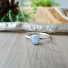 A pretty blue genuine Aquamarine for your finger! These are natural stones and each is unique and will vary in colour and size a bit. A Sterling Silver ring with a smooth 6mm pale milky blue Aquamarine gemstone for stacking as a set or by simply itself.  * All rings are made to order and are a Final Sale. All our items are final sale but this is a reminder that I am creating this item just for you in the size you are requesting, so please ensure you are ordering your perfect size. - - - - - - - Blue Minimalist Aquamarine Jewelry, Everyday Blue Sapphire Ring, Blue Sterling Silver Crystal Ring With Natural Stones, Blue Natural Stone Crystal Ring In Sterling Silver, Blue Moonstone Birthstone Ring In Sterling Silver, Blue Moonstone Healing Ring, Minimalist Blue Crystal Birthstone Ring, Blue Topaz Rings With Natural Stones, Handmade Aquamarine Blue Rings