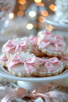 pink and white decorated cookies on a plate