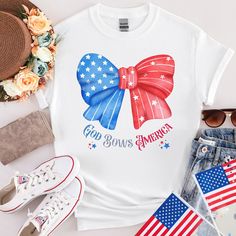 "Why not combine great design with great quality? With this T-shirt, you will have it all!!  Stand out with this super cute American Bow \"God Bows America\" perfect for 4th of July matching with your besties. Celebrate this special day with a special shirt for everyone!! 🇺🇸 The design is unisex heavy cotton tee as a basic of any wardrobe. It is the foundation upon which casual fashion grows. No side seams mean there are no itchy interruptions under the arms. The shoulders have tape for improv Cute Cotton T-shirt For 4th Of July, Cute Short Sleeve Shirt For 4th Of July, Cute American Flag Print Short Sleeve T-shirt, White Custom Print Top For Independence Day, Cute Cotton Independence Day Top, Independence Day Cotton Tops With Custom Print, Cute Short Sleeve Tops For Independence Day, Cotton Tops With Custom Independence Day Print, Cute Cotton Top For Independence Day