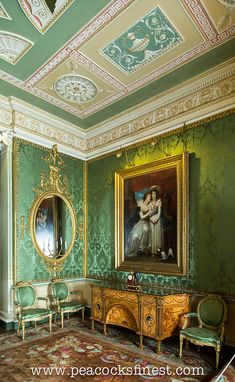 an ornately decorated room with green walls and gold trim