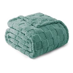 two towels stacked on top of each other, one is green and the other is blue