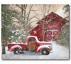 a red truck is parked in front of a barn with snow on the ground and trees