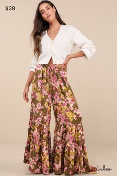 Weekends are for slow evenings and flawless looks like the Lulus Sweeter Sunsets Olive Green Floral Satin Tiered Wide-Leg Pants! Sleek woven satin, with a pink, ivory, and yellow-hued floral print throughout, shapes these breezy pants with a high-rise fit and an elasticized waistband with decorative drawstring ties. The wide pant legs boast a tiered silhouette before ending at full-length hems. Fit: This garment fits true to size. Length: Floor length. Size medium Inseam: 31.00 Front Rise: 13.50 Tiered Pants, Pink Ivory, Wide Pants, Bottom Clothes, Bottoms Pants, Leg Pants, Floor Length, Wide Leg Pants, Casual Pants