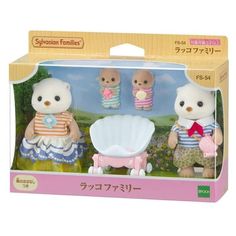 two small teddy bears are in a box with the same outfit as they stand next to each other