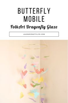 the butterfly mobile is made with paper butterflies