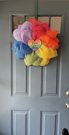 a colorful wreath hanging on the front door