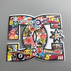 the letter d is made up of many different types of stickers and logos on it