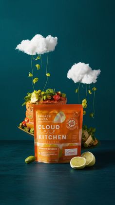 an orange bag sitting on top of a table next to some lemons and clouds