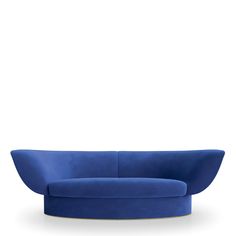 a blue couch sitting on top of a white floor