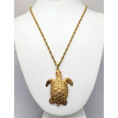 This is part of Chairish’s Costume Jewelry assortment.  1960s goldtone turtle with small round faux-garnet eyes and articulated neck (which moves with movement, giving it a lifelike effect) necklace with spring ring clasp. Marked "NAPIER" on the spring ring that the clasp attaches to. Pendant without bale measures: 2 1/4 inches long by 1 3/4 inches. Chain doubled measures: 12 inches long. Condition: Very good; minor wear to back of the pendant. Gold-tone Metal Jewelry Collectible, Gold-tone Metal Jewelry For Collectors, Collectible Brass Costume Jewelry Necklaces, Vintage Gold-tone Pendant Jewelry, Hallmarked Costume Jewelry Pendant, Collectible Gold-tone Brass Jewelry, Collectible Gold-tone Pendant Jewelry, Vintage Gold-tone Necklace With Large Pendant, Vintage Tarnish-resistant Pendant Necklace