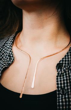 This beautiful necklace is a new, dramatic version of our Hammered Collar Necklace. We form a single piece of metal into an asymmetrical shape that is inspired by our Sunburst Necklace. The metal is flattened in the front and the length measures approximately 9″ at the longest piece. Choose from 14K GOLD FILL, 14K ROSE GOLD FILL, or STERLING SILVER. This necklace can be great for everyday wear or for a special evening out. It’s simple, clean and incredibly eye-catching. This necklace makes a gor Elegant Hand Forged Choker Necklaces, Elegant Hand Forged Drop Jewelry, Rose Gold Drop Jewelry For Party, Modern Rose Gold Metal Necklace, Unique Rose Gold Metal Necklace, Rose Gold Long Drop Necklace Gift, Rose Gold Lariat Necklaces For Party, Elegant Adjustable Hand Forged Necklaces, Rose Gold Lariat Necklace For Party