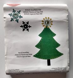 an envelope with a christmas tree and snowflakes on it