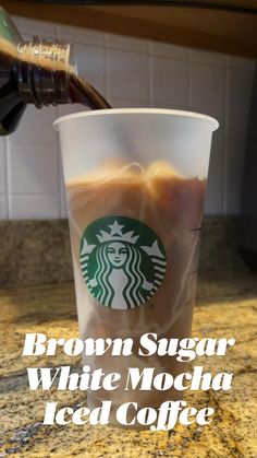 a cup of coffee with the words brown sugar white mocha iced coffee