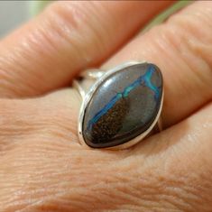 Natural Brown Boulder Opal Ring Set In .925 Solid Sterling Silver. Sz 7. The Stone Weighs 6.03 Grams. Beautiful Blues And Greens Flash In This Lovely Ring. If It Would Fit Any Finger Besides My Wedding Ring Finger, I Would Keep It For Myself. But, Alas, It Does Not, So Therefore Some Lucky Individual Will Get To Enjoy Its Secrets. My Wedding Ring, Wedding Ring Finger, Pink Stone Rings, Boulder Opal Ring, Healing Crystal Ring, Larimar Rings, Swirl Ring, Artisan Rings, Purple Agate