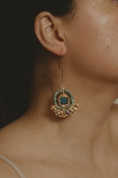 Make a statement with these beautiful handmade Estela Drop Earrings! The elegant, intricate design adds a special touch, and the colorful designs will be sure to stand out at any event. The intricate design adds a unique sophistication, while the dazzling colors will be sure to turn heads - the perfect accessory for any occasion. Details Size: 2.75" H x 1.25" W Elaboration Time: 2.5 hours Material: Faceted crystals Metal: gold plated, hypoallergenic, nickel free Technique: Herringbone technique Please Note: Each pair is made by hand and therefore one-of-a-kind.Care Instructions: This item should be kept in a dry space when not wearing. Statement Earrings Colorful, Colorful Wedding Jewelry, Ornate Festive Earrings With Intricate Design, Traditional Earrings With Intricate Design, Traditional Intricate Drop Earrings, Elegant Ceremonial Earrings With Motifs, Ceremonial Earrings With Intricate Design, Vintage Indian Jewelry, The Dazzling