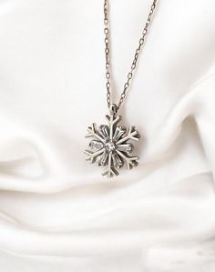 This stunning sterling silver snowflake necklace is the perfect way to add a touch of winter magic to your look! ❄️ Ideal for everyday wear or special holiday events, this dainty piece is designed to capture the beauty of snowflakes in an elegant and minimalist style. Whether you're looking for a unique Christmas gift or simply love the winter season, this snowflake pendant will be a timeless addition to your jewelry collection. ❄️ Snowflake design symbolizes beauty, purity, and individuality. ? Cheap White Christmas Necklaces, Hope Flower, Winter Necklace, Snowflake Necklace, Winter Gifts, Unique Christmas Gift, Winter Jewelry, Snowflake Pendant, Winter Birthday