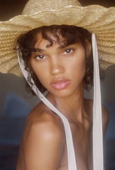 a woman wearing a large straw hat