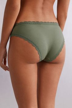 Cotton panties trimmed with a small delicate lace ruffle. The inner gusset is in 100% cotton. Ideal for those looking for a simple, romantic, and comfortable panty.

The lace contains a 100% recyclable degradable polyamide fiber that degrades ten times faster than traditional polyamide.

The model is 5’ 9” (175 cm) tall and is wearing a size 8/10 S. Cotton panties trimmed throughout with a romantic lace ruffle. Ideal for those looking for a simple, romantic, and comfortable panty. Inner gusset i Cotton Lace Trim Brief Bottoms, Cheap Women's V-neck Intimates, Cheap Lace V-neck Intimates, Cheap V-neck Intimates With Removable Bra Pads, Cotton Lace Trim Briefs, V-neck Stretch Sleepwear With Lace Trim, Briefs, Romantic Lace, Lace Ruffle