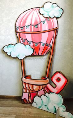 a painting of a hot air balloon with the number nine painted on it's side