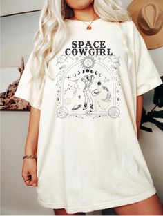 "Bachelorette Aesthetic Shirt, Our Space Cowgirl Tee with cosmic details is perfect for all those late night rides. You Can also use it as a Halloween Cowgirl costume or a perfect addition to your Western Vibe aesthetic Clothes. Vintage western trend. * Q U I C K * F A C T S * ♥️ 100% Soft cotton ♥️Design is high quality digital print ♥️ Wash and dry normally. Do not iron directly on the print. * S I Z I N G * ♥️ Sizing is unisex so runs like men's, though not overly large ♥️Most women find thei Celestial Shirt, Christian Crewneck, Jesus Clothes, Texas Shirt, Country Music Shirt, Preppy Shirt, Christian Merch, Disco Cowgirl, Space Cowgirl