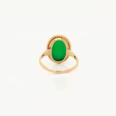 A fine antique Edwardian cabochon ring.  In 14 karat yellow gold.  Bezel-set with an oval chrysoprase sugarloaf cabochon in a beaded & twisted wire setting.  Marked 14k to the shank.  Simply a wonderful vintage ring!  Date: Late 19th or Early 20th Century  Overall Condition: It is in overall good, as-pictured, used estate condition.  Condition Details: There is a small spot of loss and some light bending & indentations to the bezel setting. Otherwise, there are some fine & light surface scratches and other signs of expected light wear consistent with age.  Marks:  Marked 14k to the interior shank.  Fineness: Marked 14k for gold fineness.   Ring Size: ca. 3.75  Gemstone Measurements: 1 chrysoprase cabochon: ca. 12.5mm x 8.5mm  Measurements: Height: ca. 14mm Width: ca. 16mm Depth: ca. 24mm Twisted Wire, Cabochon Ring, Bezel Setting, Vintage Rings, Ring Size, Yellow Gold, Gemstones, Gold