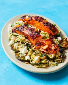 a white plate topped with food on top of a blue table