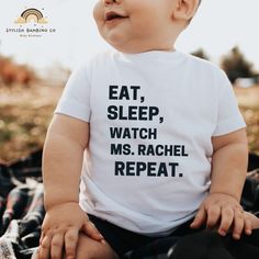 For the little ones who live by the ultimate routine, this "Eat, Sleep, Watch Ms. Rachel, Repeat" toddler shirt is a must-have! Made with soft, breathable fabric, it keeps your toddler comfy through every snack, nap, and singalong session with their favorite teacher.  Featuring a playful design that celebrates their love for Ms. Rachel, this shirt is perfect for everyday wear, playdates, or screen-time fun. Durable and easy to clean, it's a practical and adorable choice for busy toddlers and the White T-shirt With Funny Text For Parenting, White T-shirt With Funny Parenting Text, Fun Family T-shirt With Funny Text, Playful Name Print T-shirt For Mother's Day, Cute Parenting T-shirt With Letter Print, Cute Letter Print T-shirt For Parenting, Funny Letter Print T-shirt For Playtime, Ms Rachel, 1st Birthday Presents