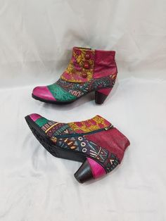 I present to your attention exclusive boots made of genuine pink leather. These women's boots, made in an original style, are comfortable and practical. The soft leather made these boots very comfortable. These vintage boots are beautifully embroidered with a variety of patterns. Be the center of attention with confidence: these boots are guaranteed to turn heads and spark conversations. Handmade, never goes out of style. One of a kind. I can send additional photos upon request. Materials: leather The shaft circumference - 10 Inches Boots height - 7 Inches Heel height - 2,5 Inches Size - (10,5 US)(42 EU) (8 UK) foot size - (10,35 Inches) (26,3 См) Thank you for your interest in our store https://kneehighbootswomens.etsy.com 🚚 Free worldwide shipping. ✅ Expedited Express Delivery. ✅ Discou Pink Ankle Martin Boots For Winter, Pink Leather Mid-calf Boots With Round Toe, Pink Leather Mid-calf Boots For Winter, Pink Leather Moto Boots With Round Toe, Pink Round Toe Heeled Boots For Winter, Retro Multicolor Boots For Winter, Winter Festival Boots With Closed Toe, Pink Round Toe Booties For Fall, Pink Leather Mid-calf Boots For Fall