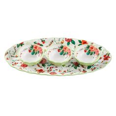 three plates with flowers and leaves on them