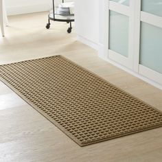 a brown mat on the floor in a room