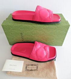 AUTHENTIC GUCCI Gucci GG Charlotte Flats Pink Leather Slides Sandals Shoes   US 7.5 G 37.5 Gucci style 694714 runs true to size Marked G 37.5   100% AUTHENTIC  GUARANTEED.  Please read my feedback.  I have been selling Authentic designer items  for 20 years on Ebay.  My store maintains the highest rating.   Gucci Designed by: Gucci Color: Fushia pink, (Bon Bon) Details: - Brand new with tags - Made in Italy -Marked a G 37.5 which according to Gucci website is US 7.5 -color is Bon Bon -double GG emblem in leather -Leather upper and lining, rubber sole -slip one design -open toe Condition: brand new with tags, 100% Authentic Shipping: UNITED STATES: - USPS Priority mail  Item will be shipped the next business day after payment clears. Buyer will be notified of tracking once item is shipped. Gucci Sandals With Rubber Sole For Summer, Designer Calf Leather Sandals With Cushioned Footbed, Luxury Sandals With Cushioned Footbed, Luxury Synthetic Sandals With Cushioned Footbed, Gucci Summer Calf Leather Sandals, Gucci Calf Leather Sandals For Summer, Luxury Slides With Leather Sole And Round Toe, Luxury Slides With Rubber Sole And Round Toe, Gucci Designer Sandals With Round Toe